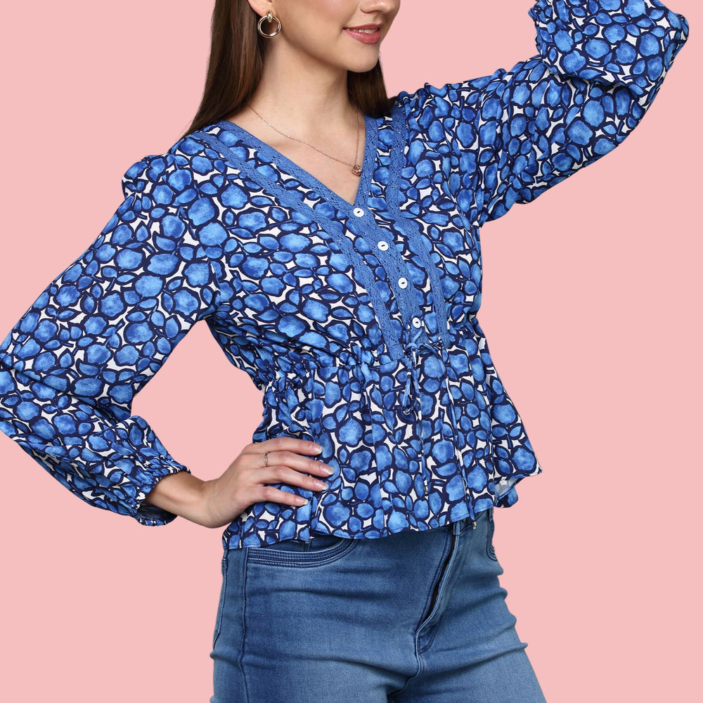 
                      
                        V- neckline Blue Printed  top with lace detail ,balloon sleeve
                      
                    