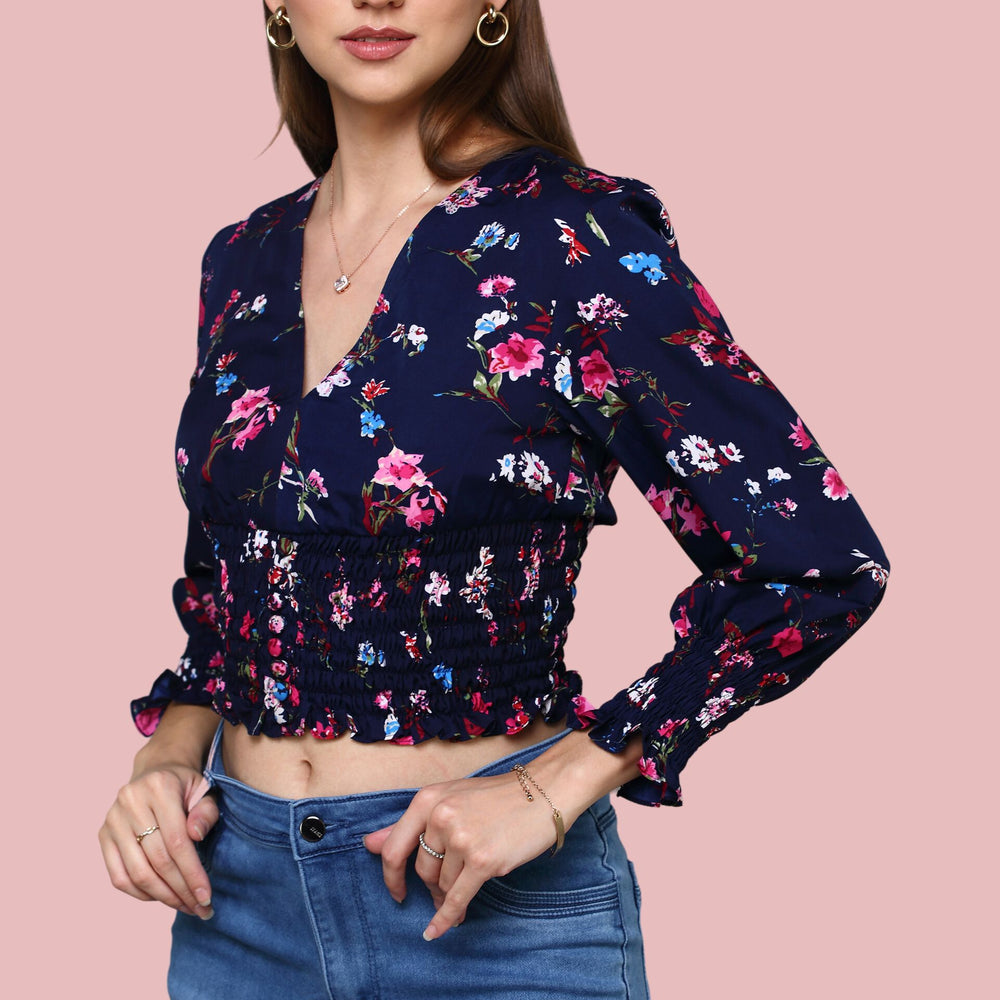 
                      
                        Navy Blue V-neckline printed top with ruching at sleeve and waist
                      
                    