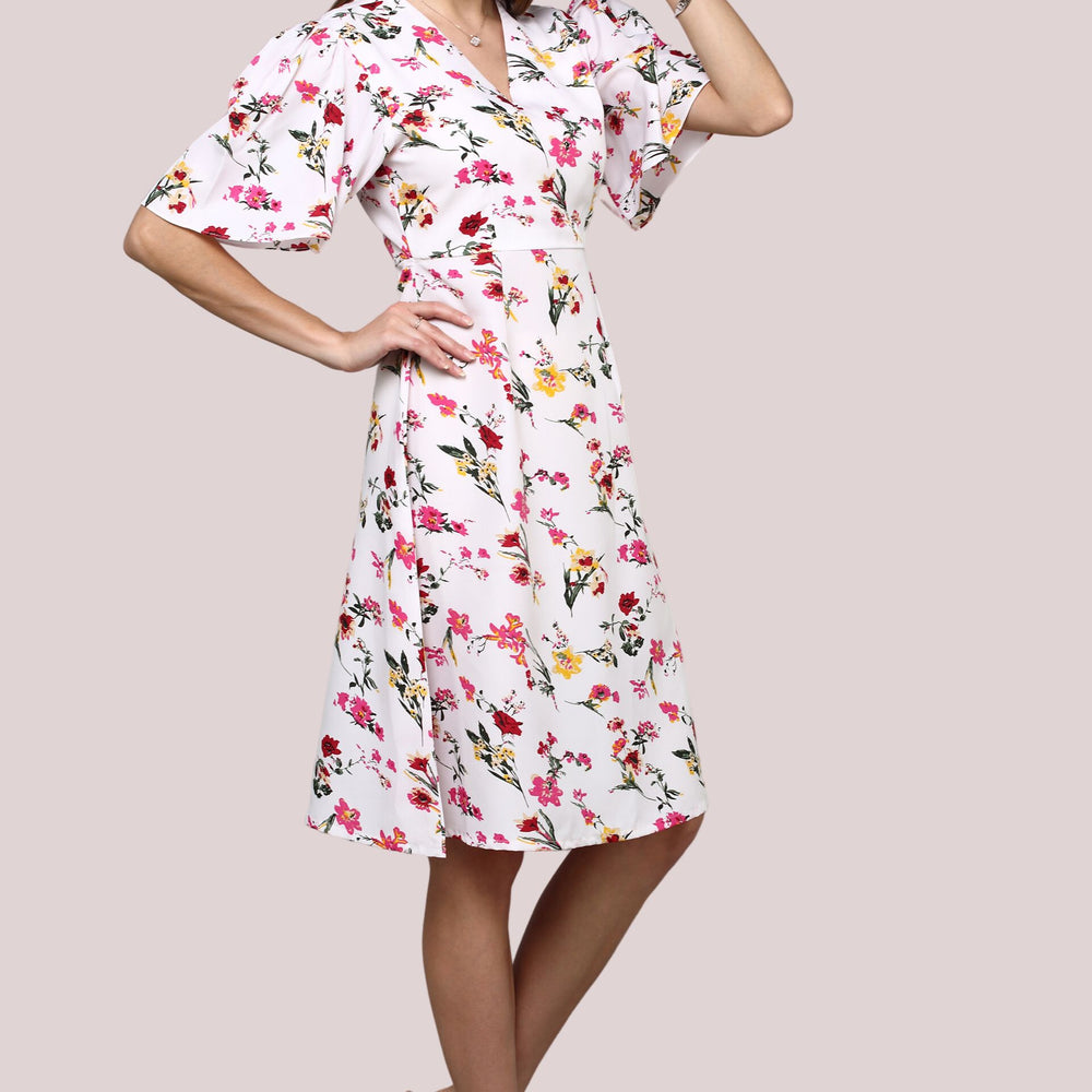 
                      
                        White Floral printed dress with flared sleeve
                      
                    