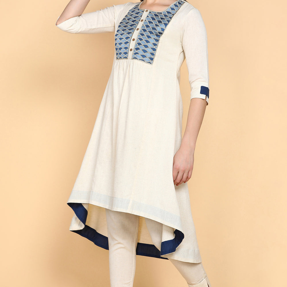 
                      
                        Cream Kurta Trouser Set With Blue Embroidery on Yok
                      
                    