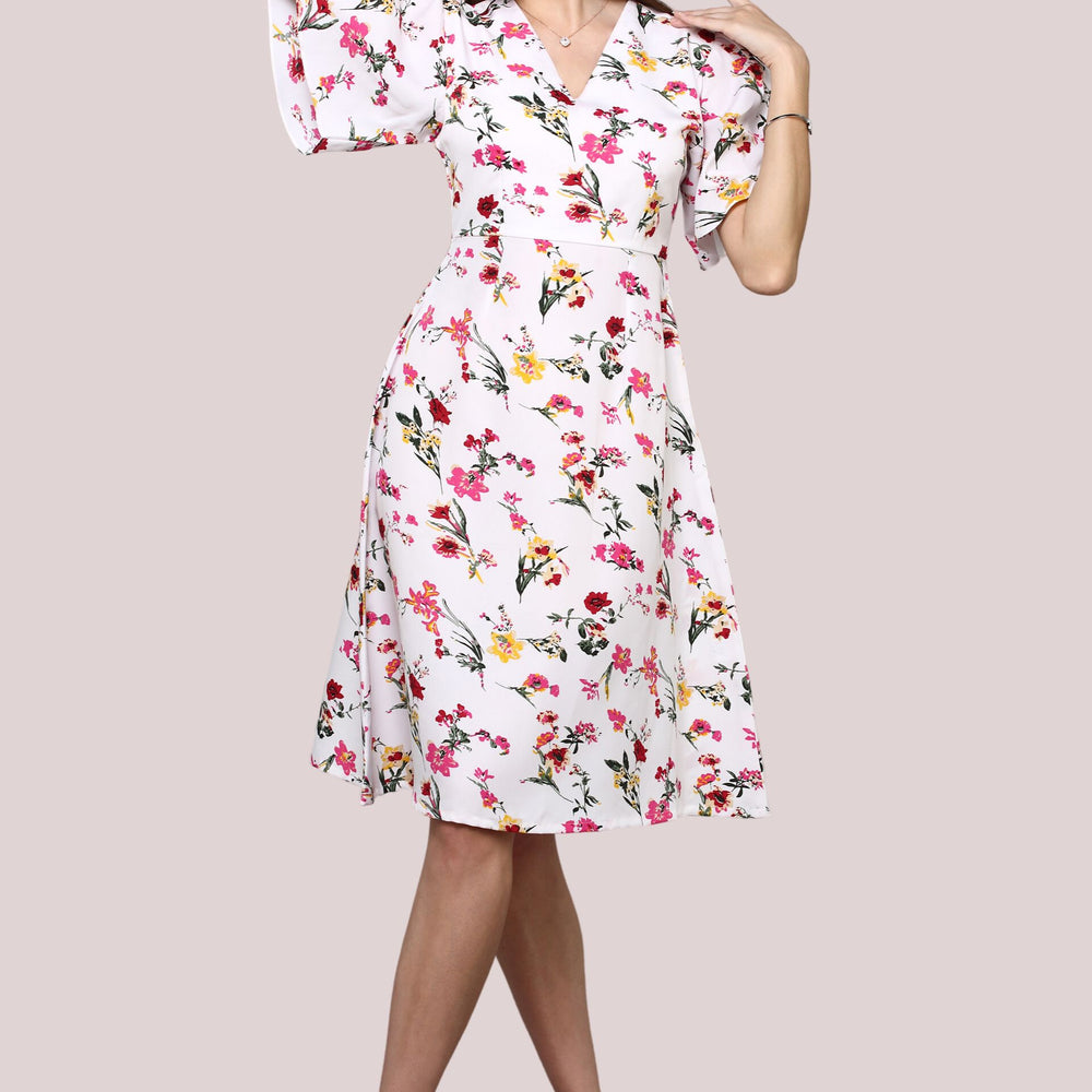 
                      
                        White Floral printed dress with flared sleeve
                      
                    