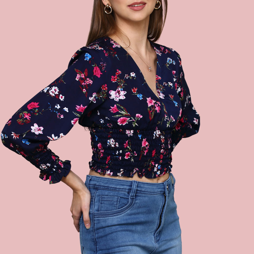 
                      
                        Navy Blue V-neckline printed top with ruching at sleeve and waist
                      
                    