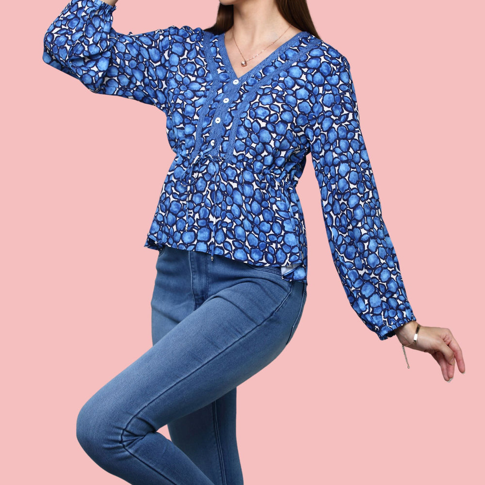 
                      
                        V- neckline Blue Printed  top with lace detail ,balloon sleeve
                      
                    