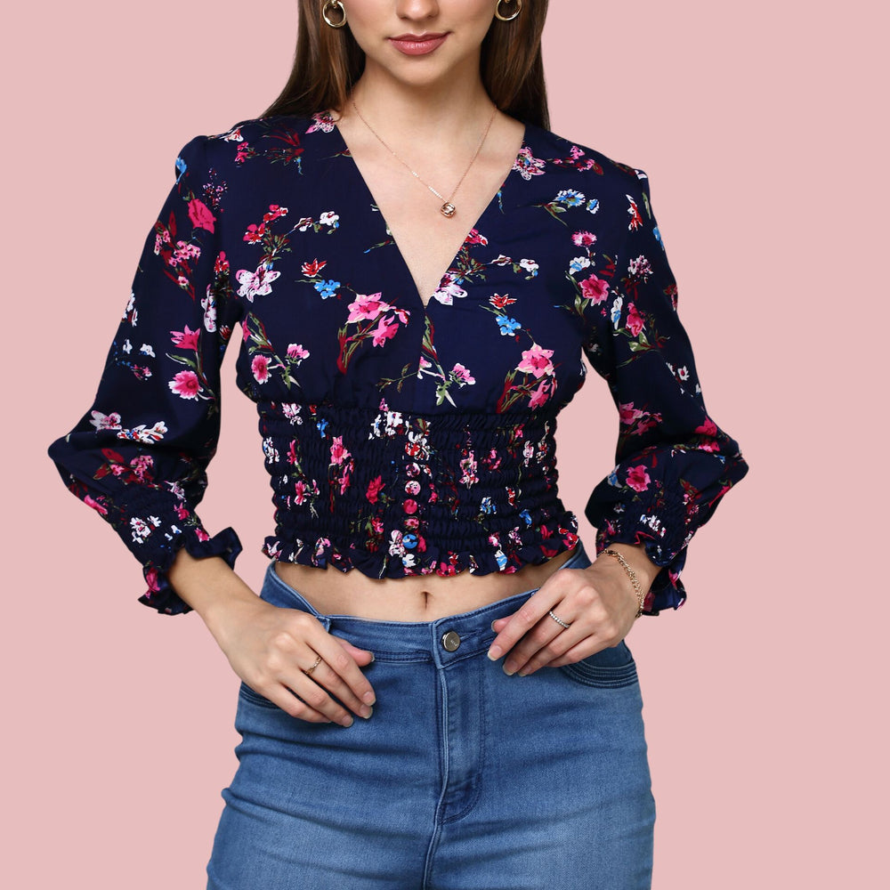 
                      
                        Navy Blue V-neckline printed top with ruching at sleeve and waist
                      
                    