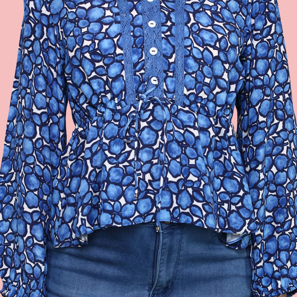 
                      
                        V- neckline Blue Printed  top with lace detail ,balloon sleeve
                      
                    