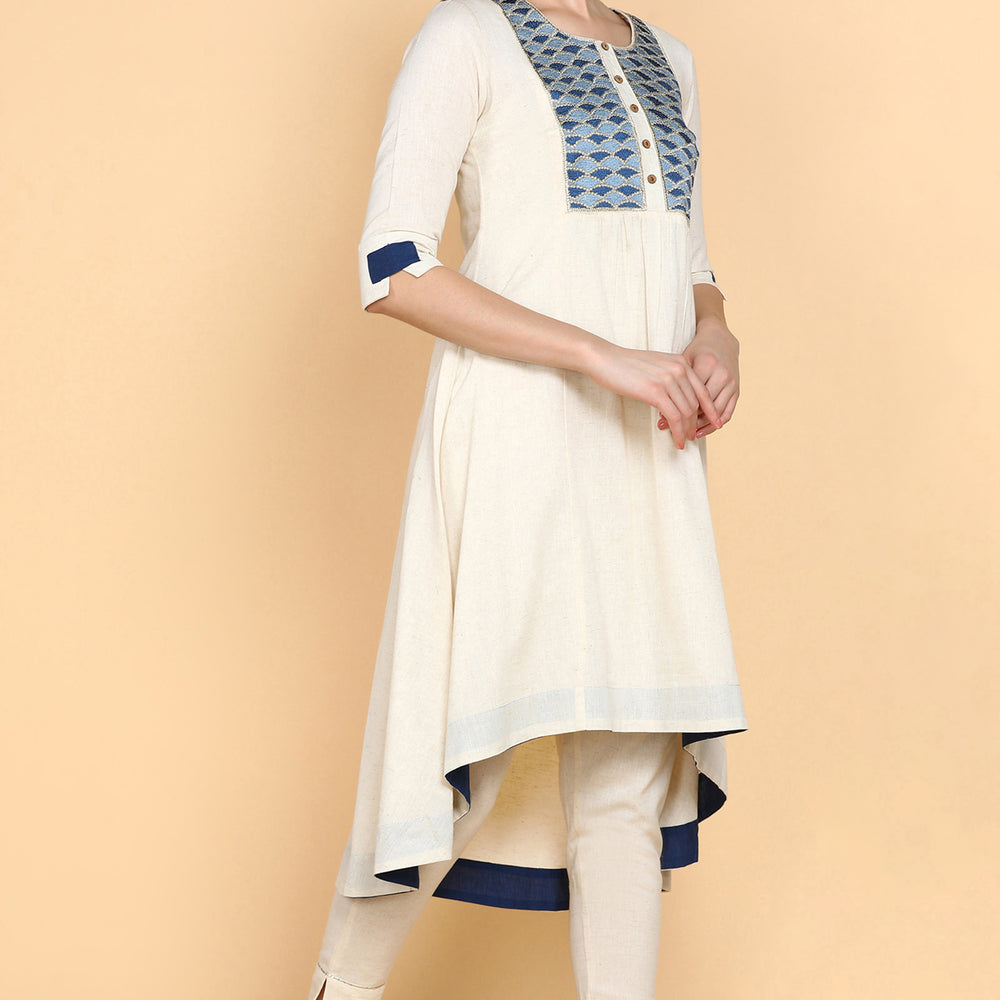 
                      
                        Cream Kurta Trouser Set With Blue Embroidery on Yok
                      
                    