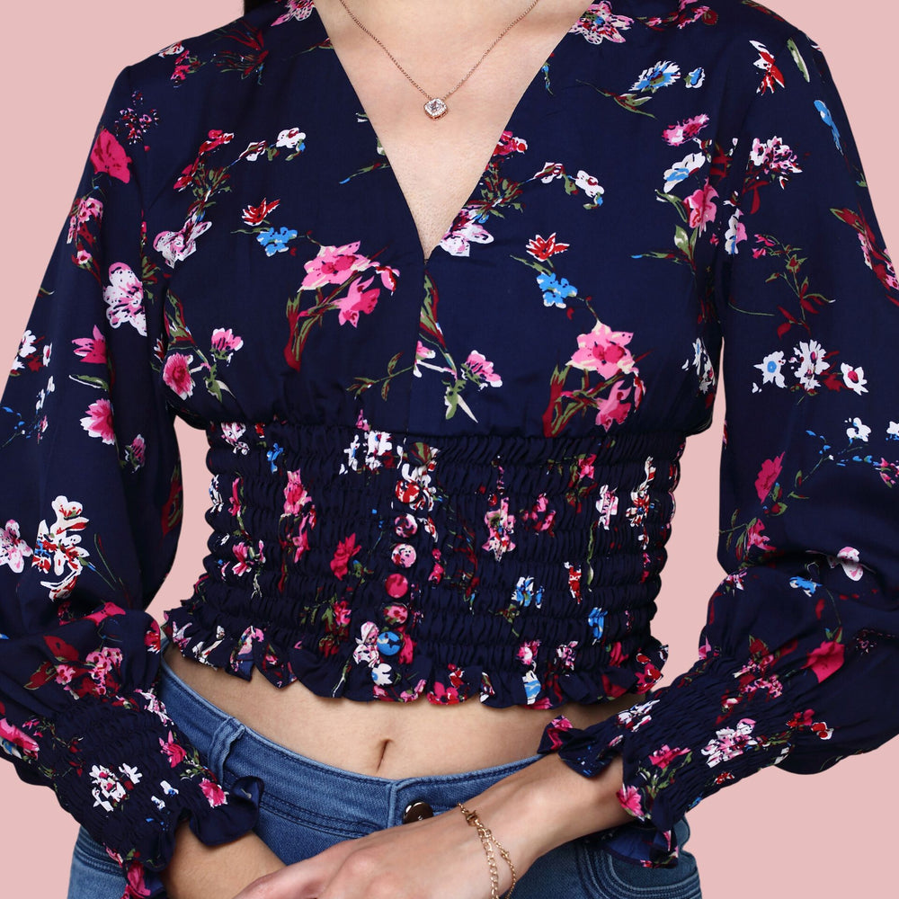 
                      
                        Navy Blue V-neckline printed top with ruching at sleeve and waist
                      
                    