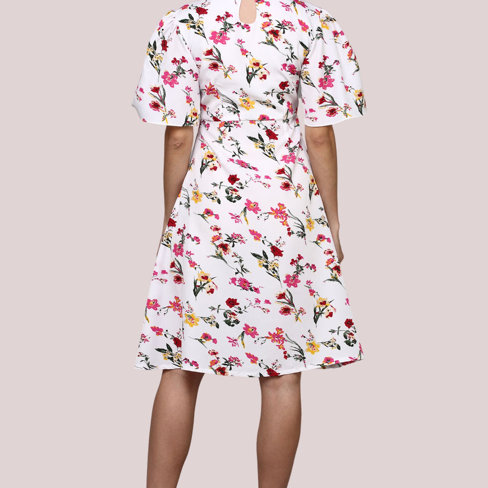 
                      
                        White Floral printed dress with flared sleeve
                      
                    