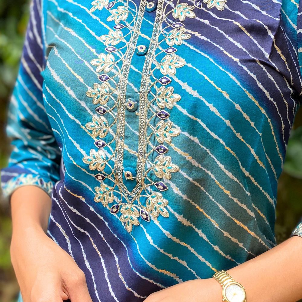 
                      
                        Shades Of Blue Leheriya Kurta with Gota Pati Work
                      
                    