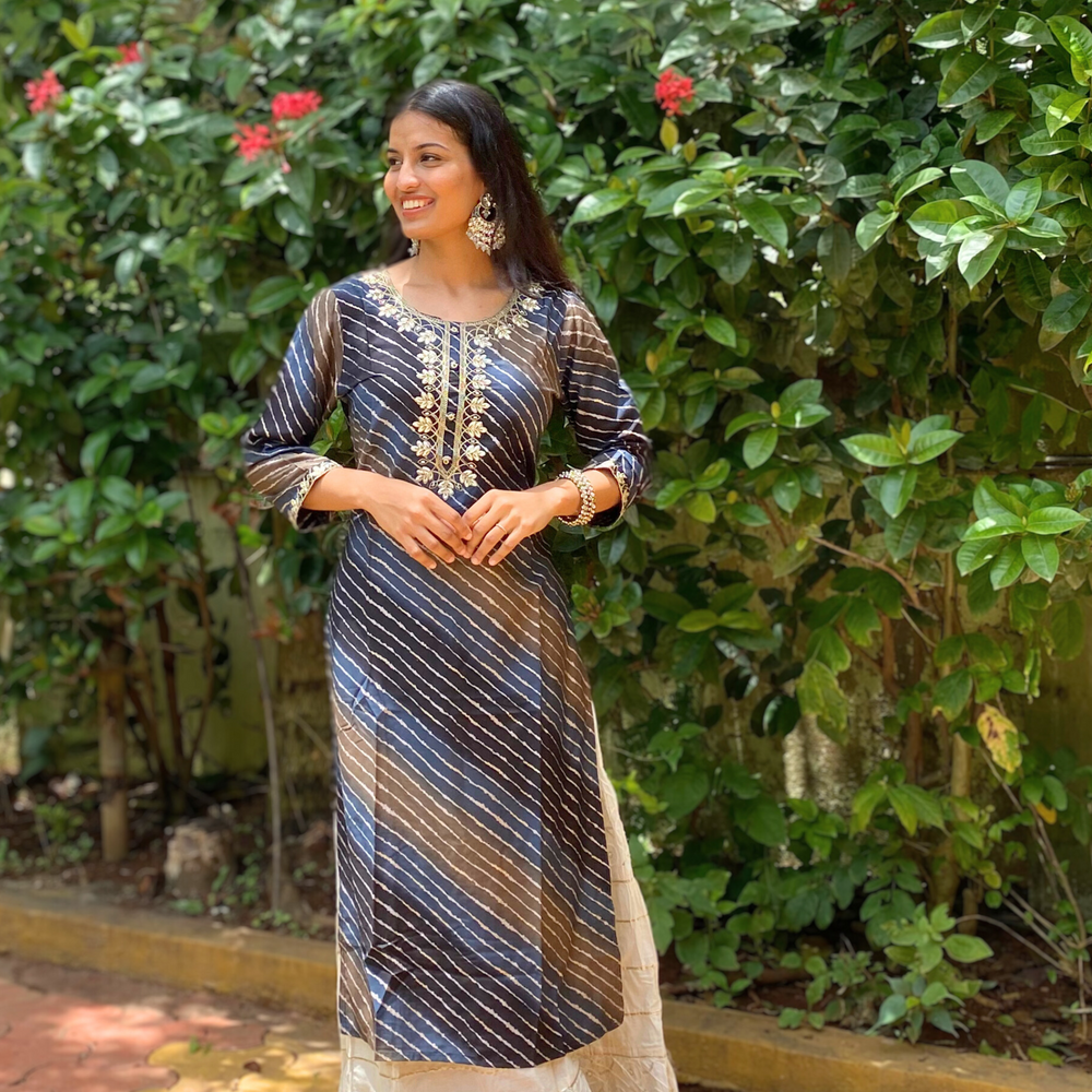 
                      
                        Shades Of Navy Blue and Brown Leheriya Kurta with Gota Pati Work
                      
                    