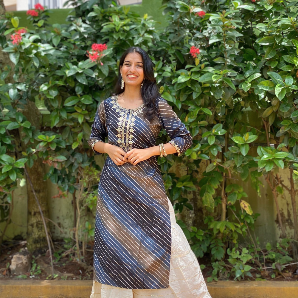 
                      
                        Shades Of Navy Blue and Brown Leheriya Kurta with Gota Pati Work
                      
                    