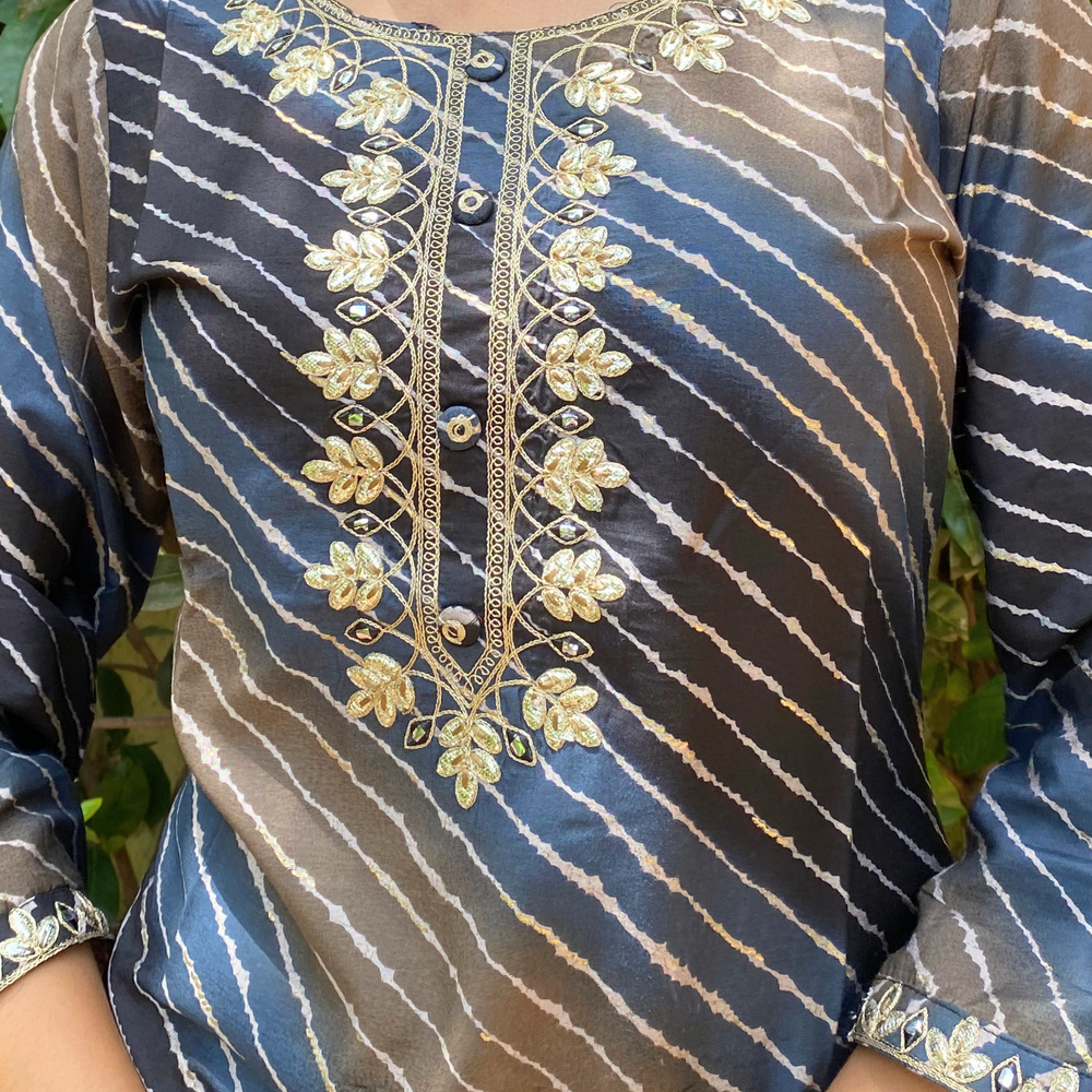 
                      
                        Shades Of Navy Blue and Brown Leheriya Kurta with Gota Pati Work
                      
                    