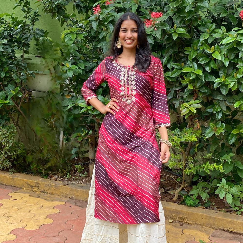 
                      
                        Shades Of Rani Pink and Violet Leheriya Kurta with Gota Pati Work
                      
                    