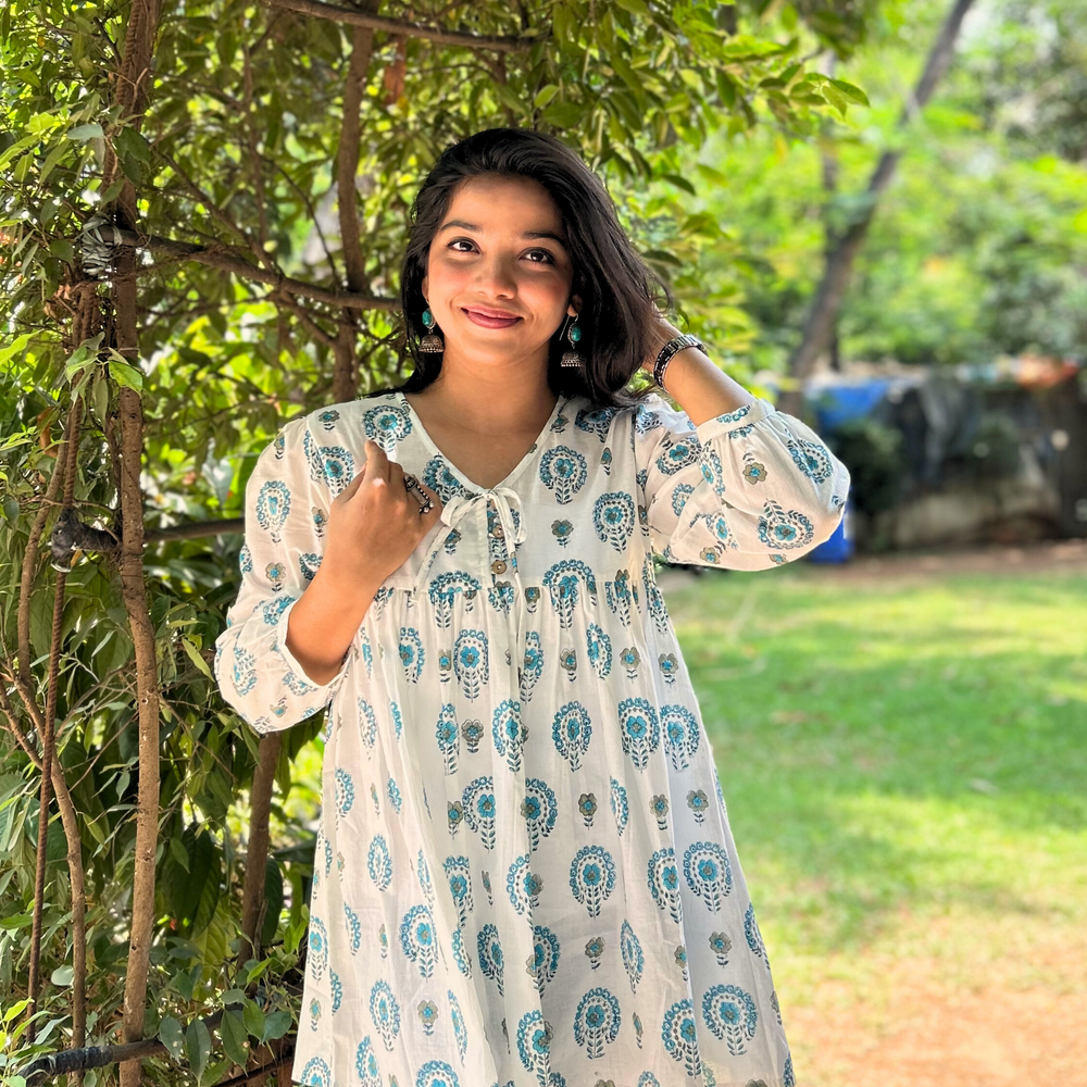 
                      
                        White And Blue Floral Printed Pure Cotton Kurti With Puff Sleeves And Wooden Buttons
                      
                    