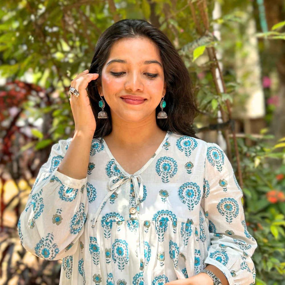 
                      
                        White And Blue Floral Printed Pure Cotton Kurti With Puff Sleeves And Wooden Buttons
                      
                    