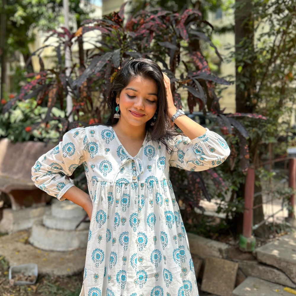 
                      
                        White And Blue Floral Printed Pure Cotton Kurti With Puff Sleeves And Wooden Buttons
                      
                    