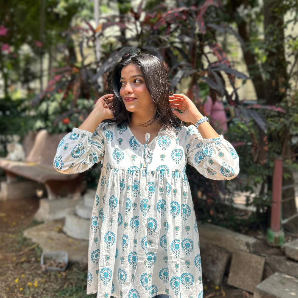 
                      
                        White And Blue Floral Printed Pure Cotton Kurti With Puff Sleeves And Wooden Buttons
                      
                    