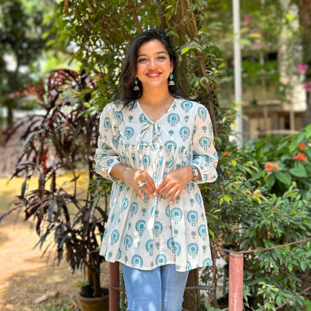 
                      
                        White And Blue Floral Printed Pure Cotton Kurti With Puff Sleeves And Wooden Buttons
                      
                    