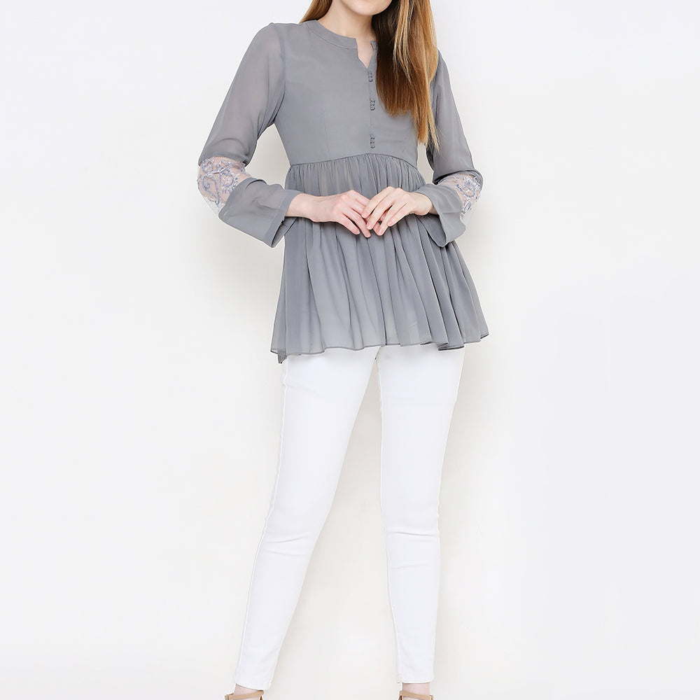 
                      
                        Grey Embellished Pure Georgette Pleated Kurti
                      
                    