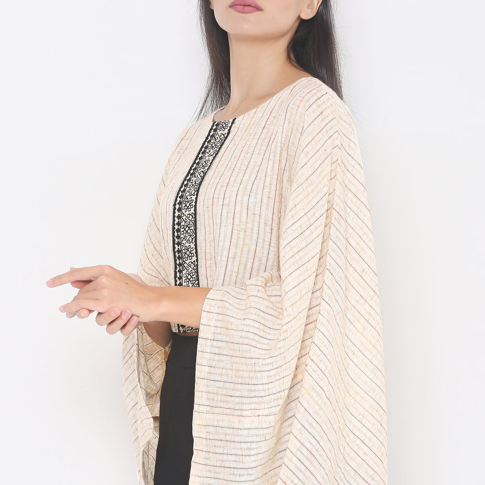 
                      
                        Aturabi Cream Colour Cape Top
                      
                    